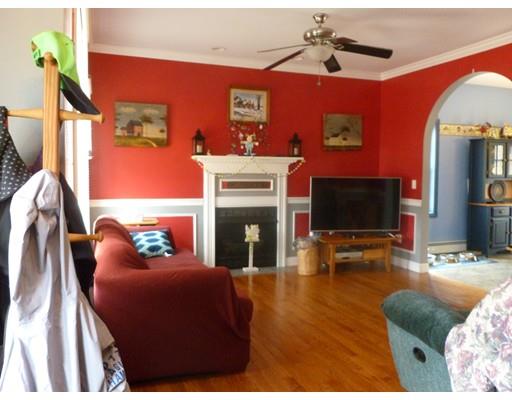 25 Lafayette Road Templeton, MA 01468 - Photo 7 of 13 a living room with furniture a flat screen tv and a fireplace