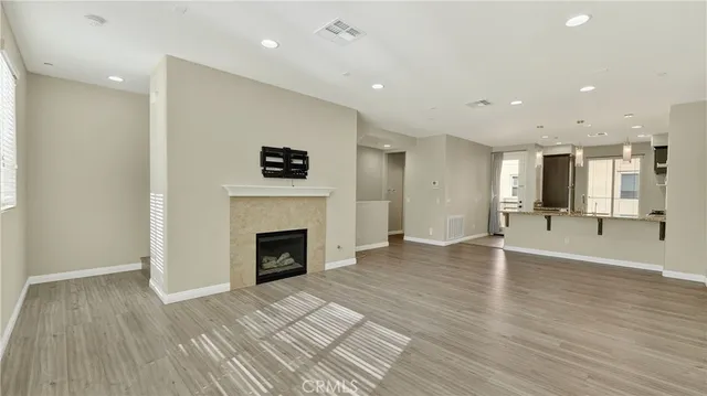 a view of an empty room and a fireplace