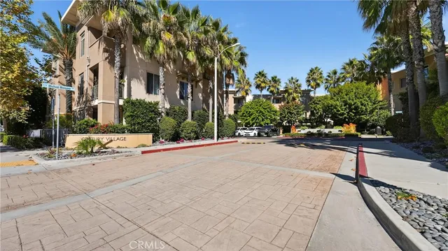 a view of a street with houses on the roadside