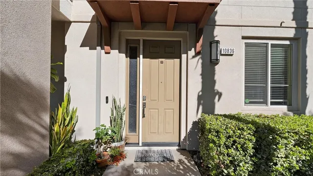 a view of a house with a flower garden