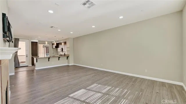 a view of kitchen with furniture and wooden floor