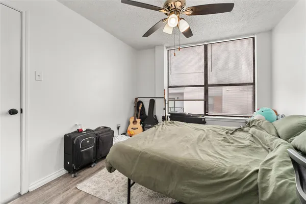 a bedroom with a bed and a tv