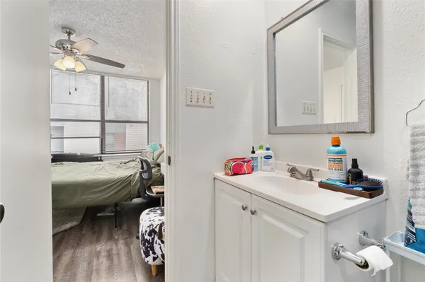 a bedroom with bed and a window