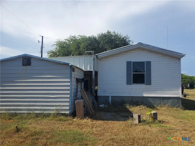 a view of a back yard of the house