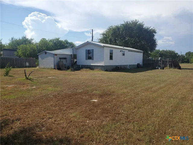 a house view with a backyard space
