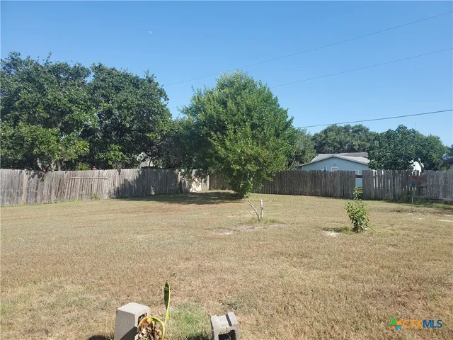 a swimming pool with wooden fence