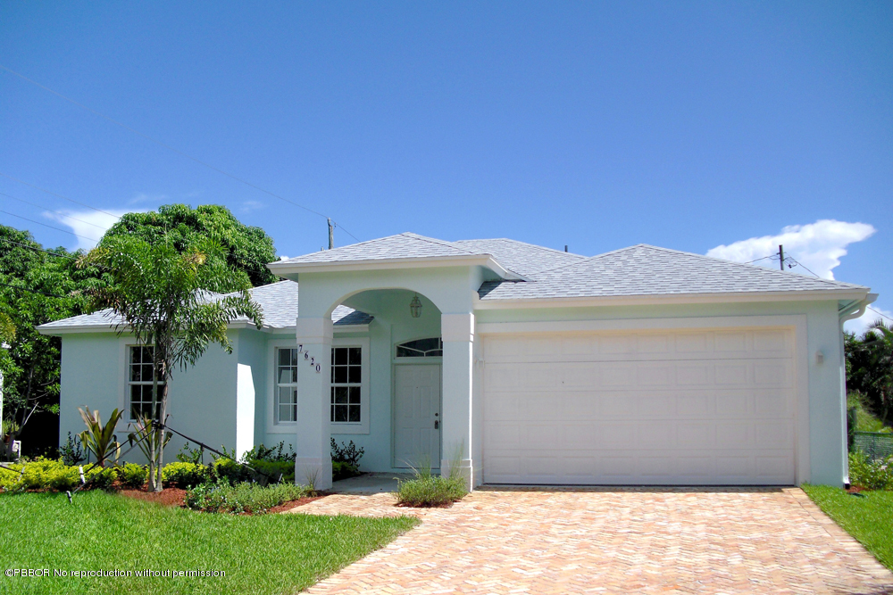 7620 Washington Road West Palm Beach, FL 33405 - Photo 1 of 1 a front view of a house with a yard