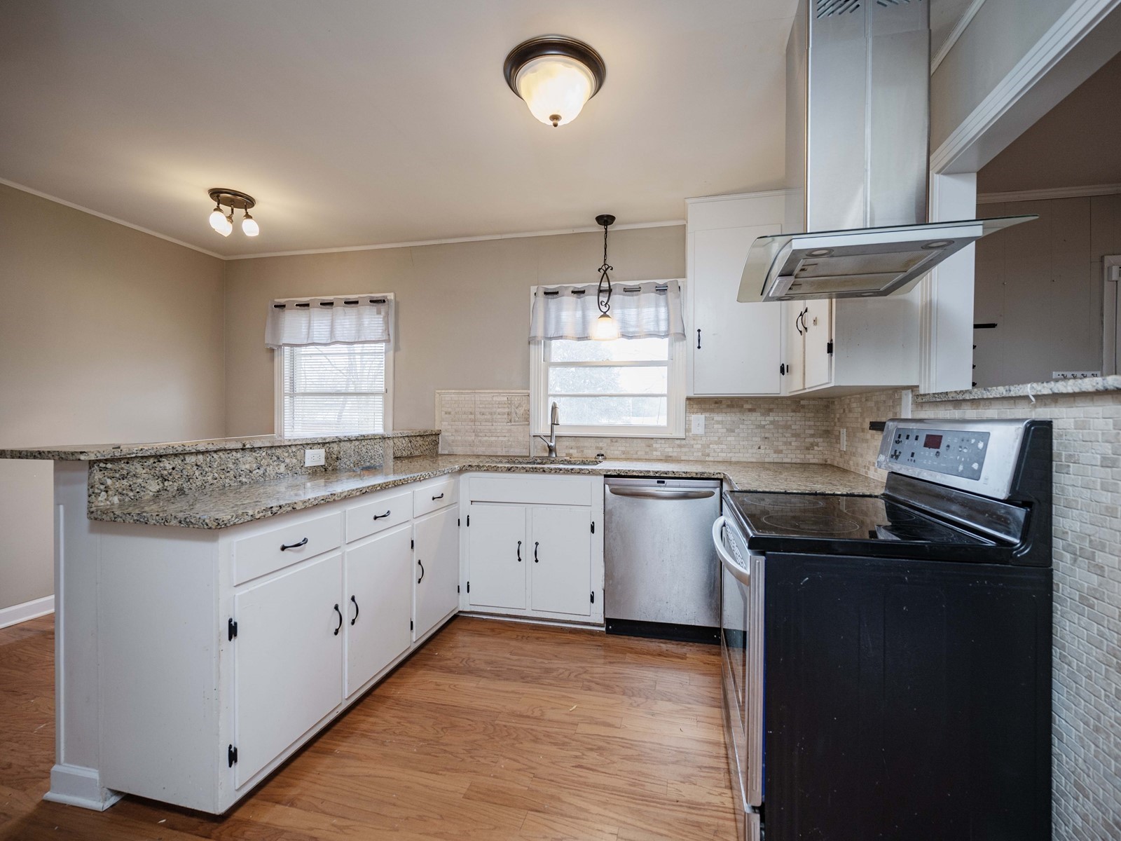 1611 White Boulevard Murfreesboro, TN 37129 - Photo 14 of 30 a kitchen with granite countertop cabinets stainless steel appliances a sink and a window
