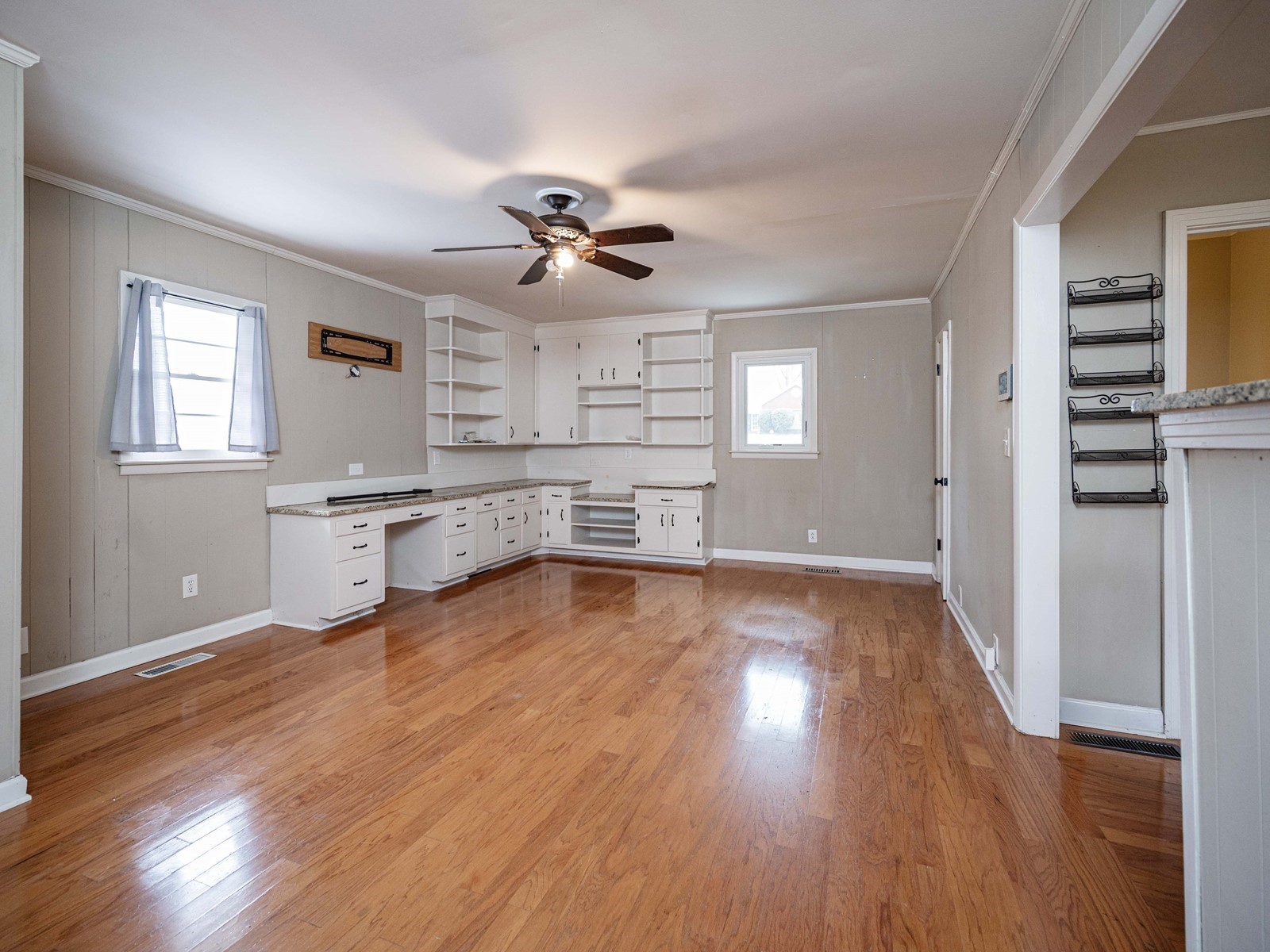1611 White Boulevard Murfreesboro, TN 37129 - Photo 18 of 30 a view of a big room with wooden floor and a kitchen
