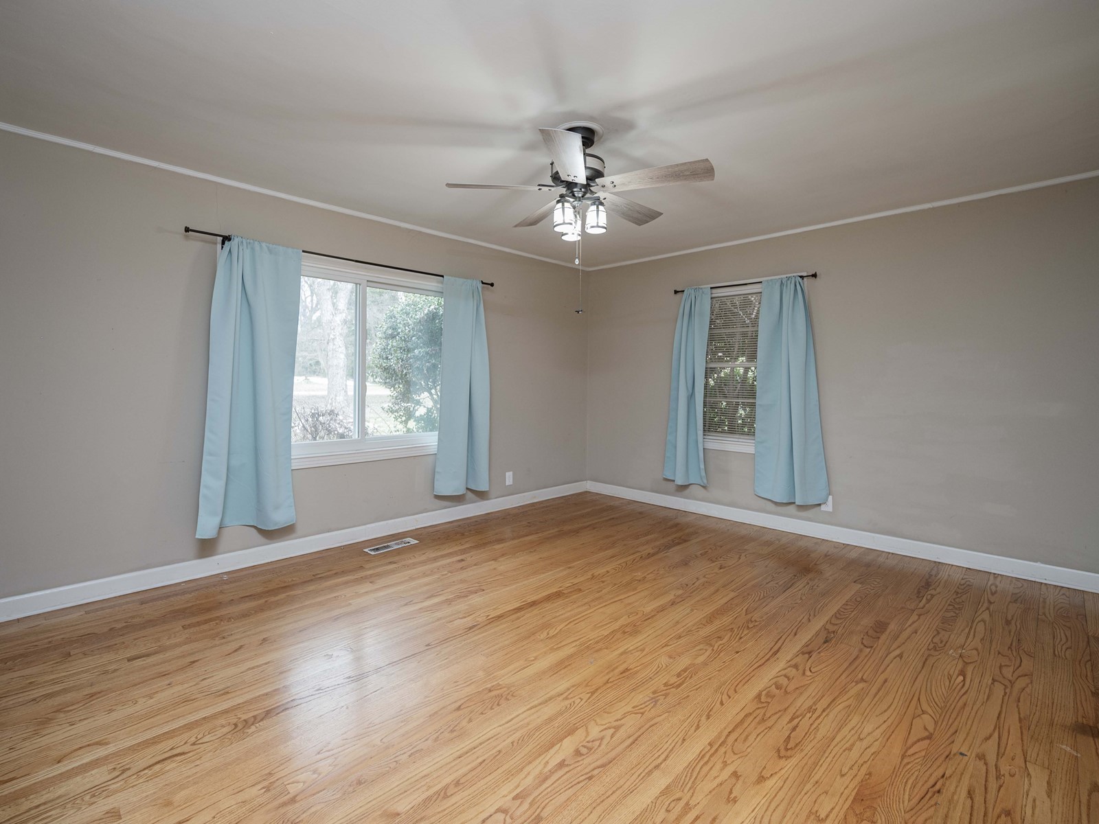1611 White Boulevard Murfreesboro, TN 37129 - Photo 22 of 30 a view of an empty room with a window and wooden floor