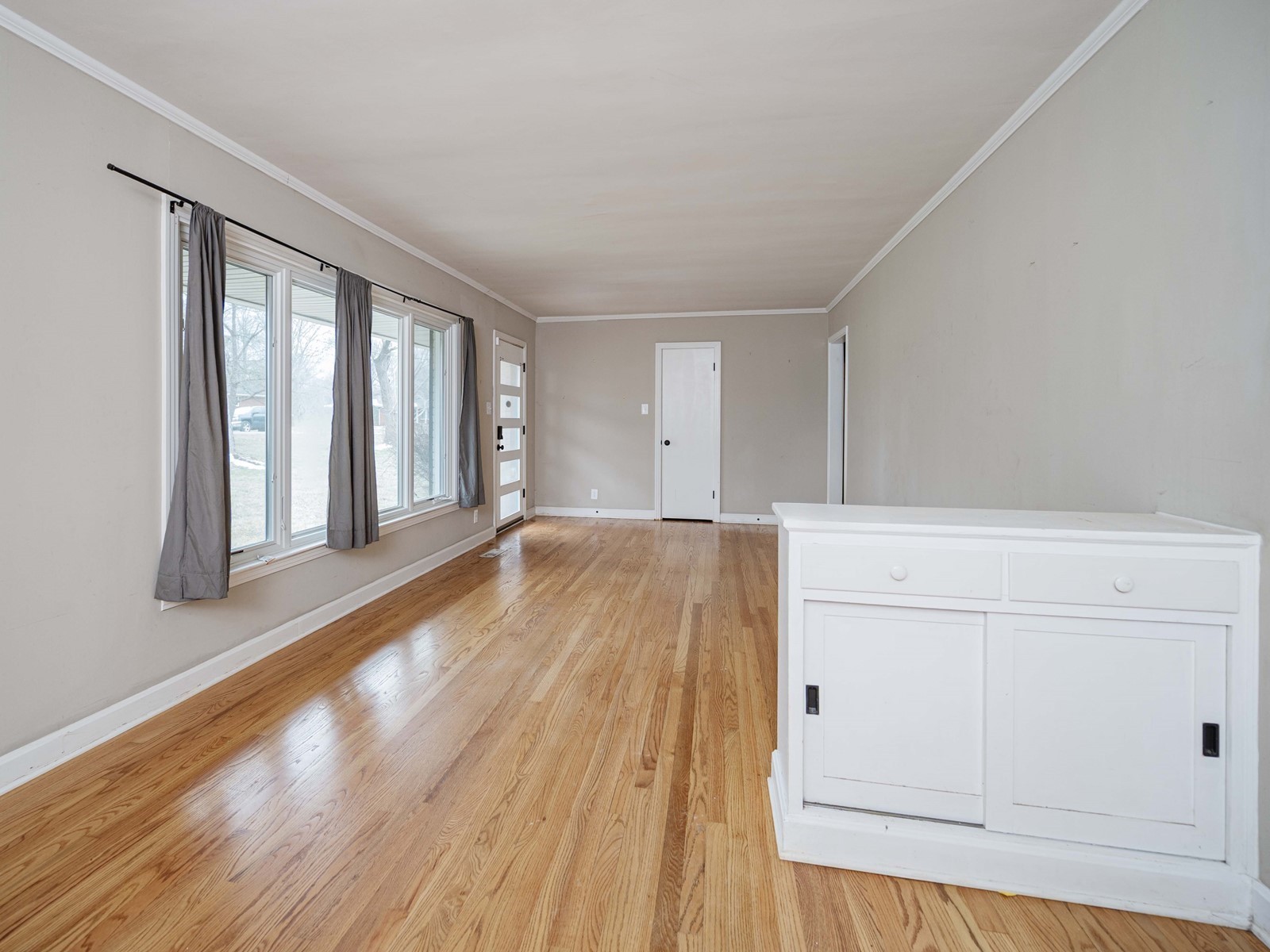 1611 White Boulevard Murfreesboro, TN 37129 - Photo 8 of 30 a view of an empty room with wooden floor and windows