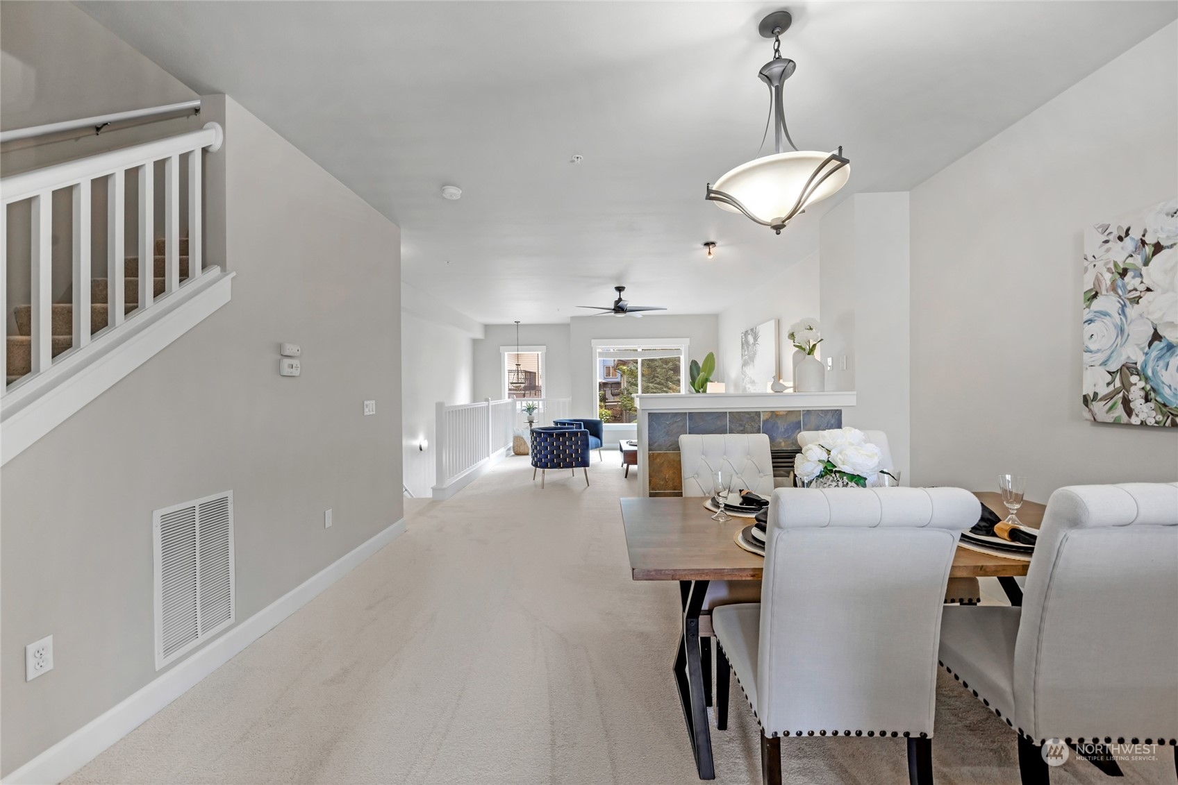 2115 201st Place Southeast, Unit D2 Bothell, WA 98012 - Photo 11 of 31 a view of a dining room with furniture and wooden floor