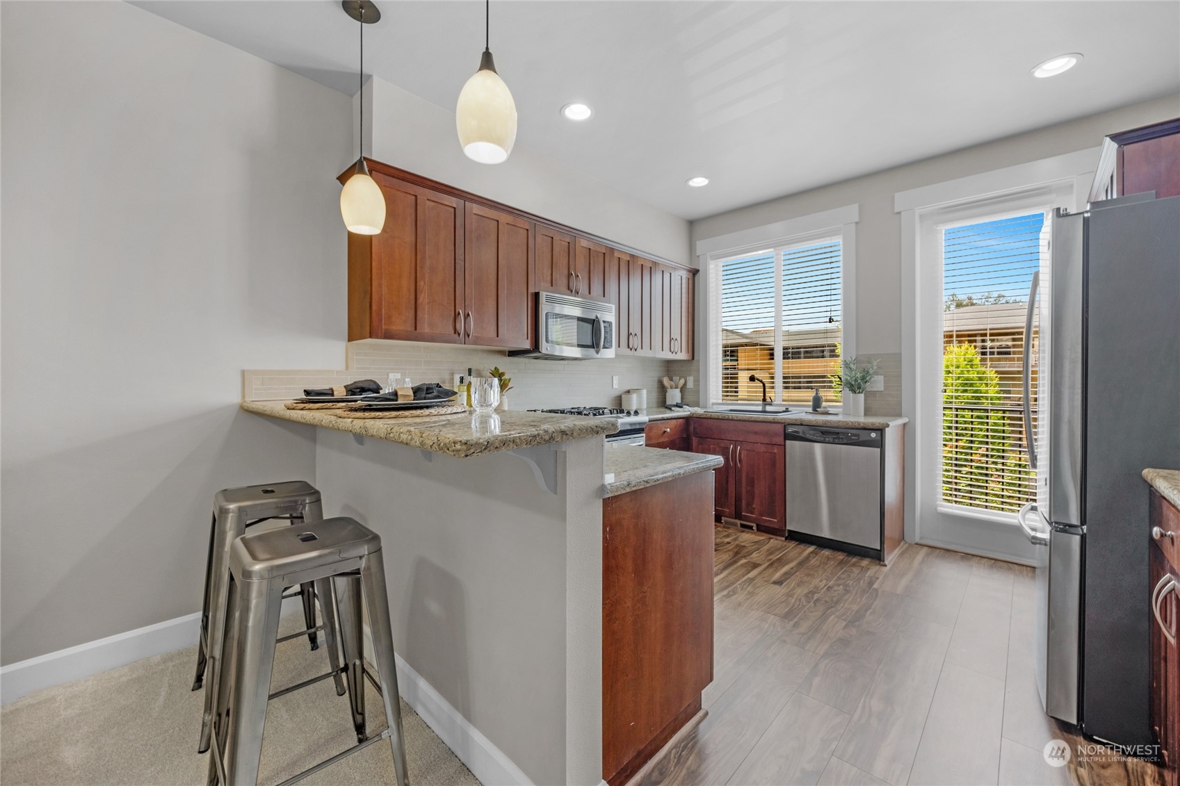 2115 201st Place Southeast, Unit D2 Bothell, WA 98012 - Photo 12 of 31 a kitchen with a sink appliances and cabinets