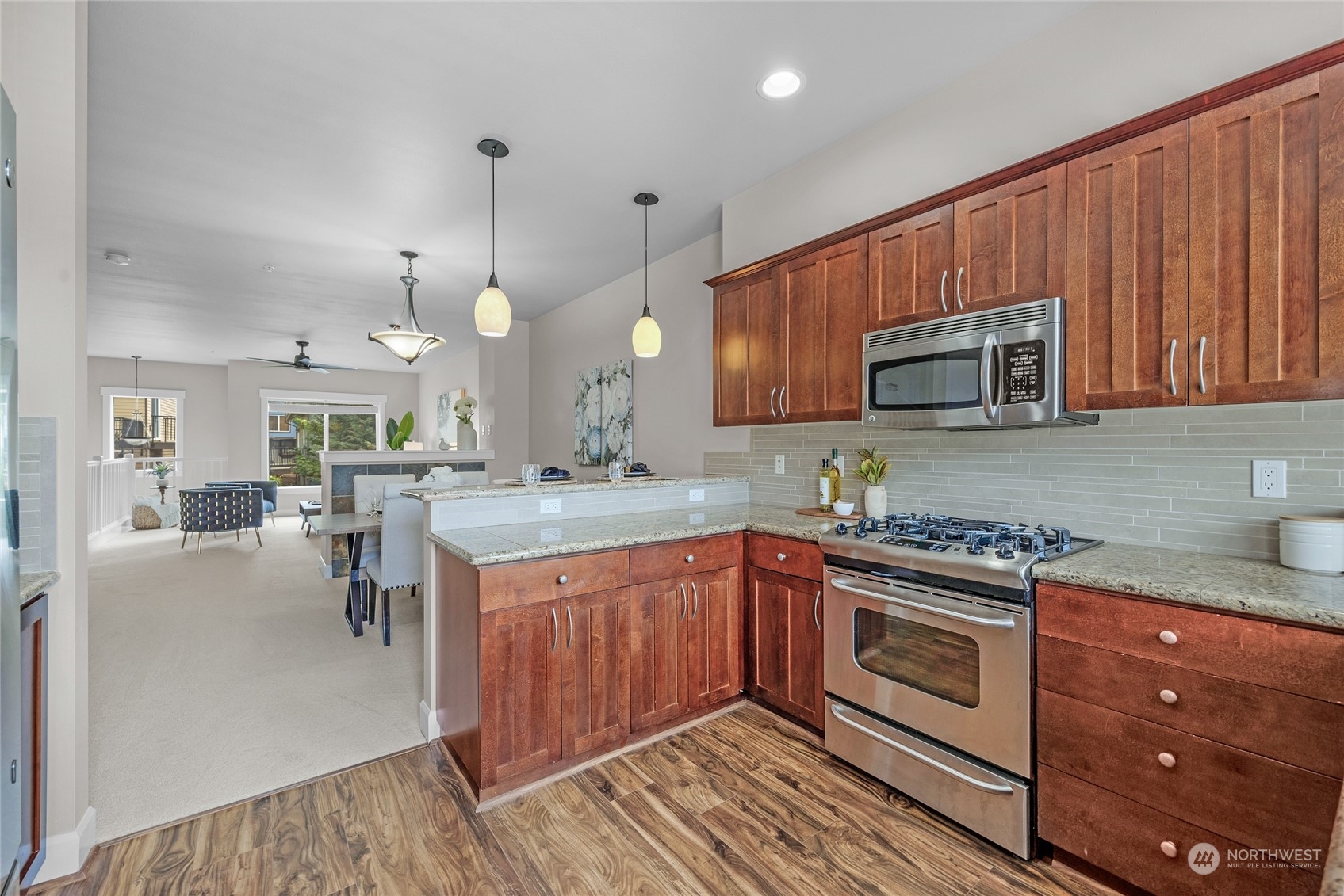 2115 201st Place Southeast, Unit D2 Bothell, WA 98012 - Photo 14 of 31 a kitchen with a sink stove and microwave
