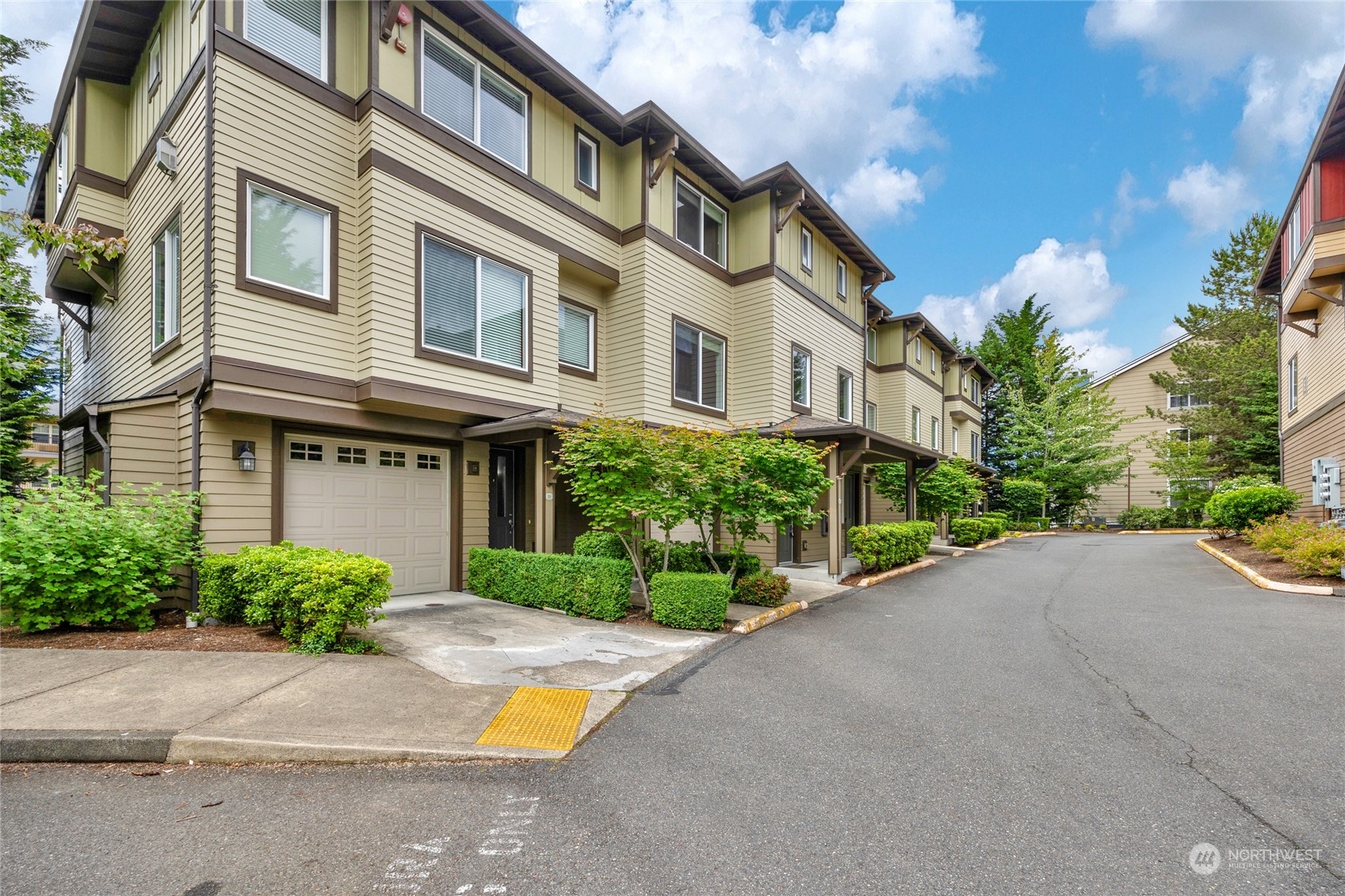 2115 201st Place Southeast, Unit D2 Bothell, WA 98012 - Photo 30 of 31 a view of a building with a yard