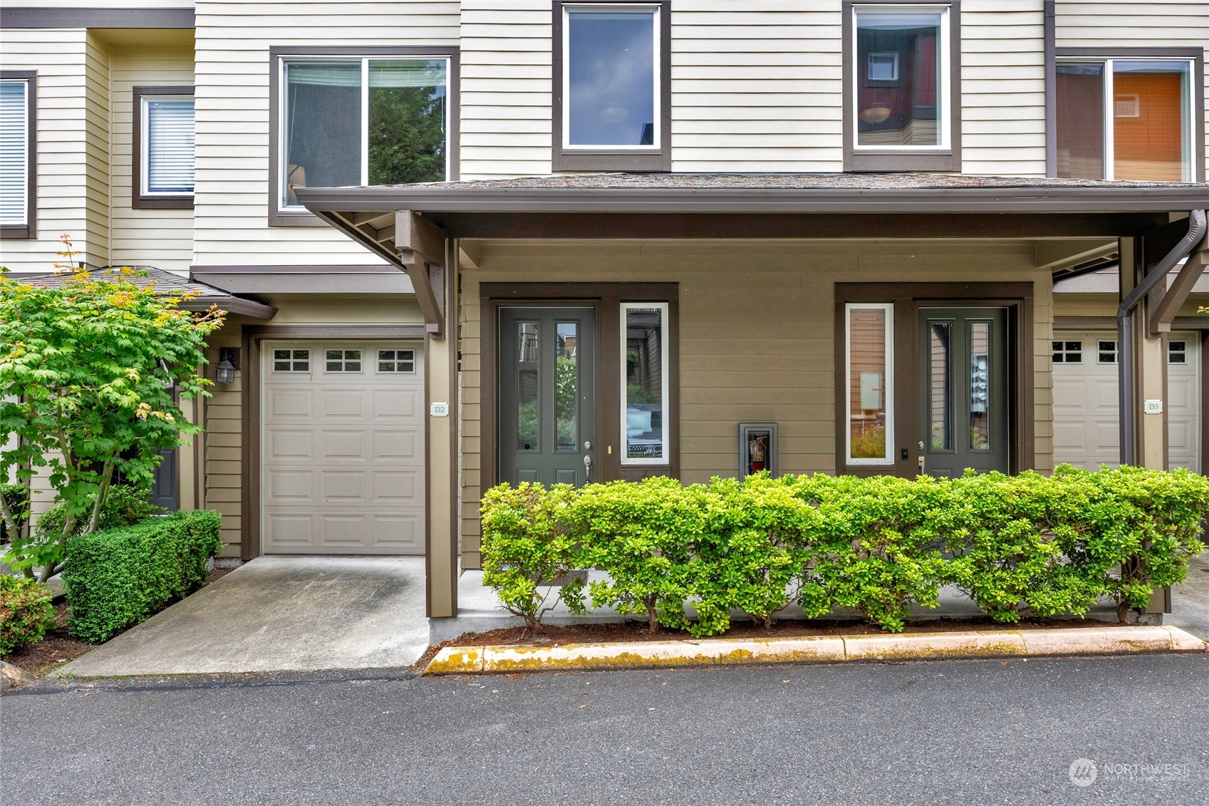 2115 201st Place Southeast, Unit D2 Bothell, WA 98012 - Photo 3 of 31 front view of a brick house with a large window