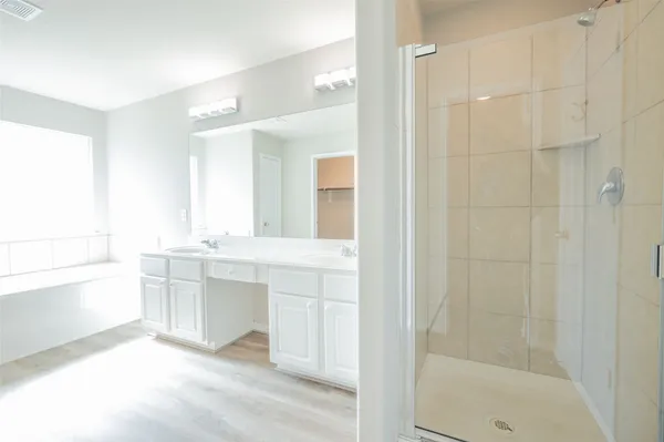 a bathroom with a bathtub and a sink