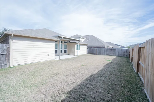 a house view with a backyard space