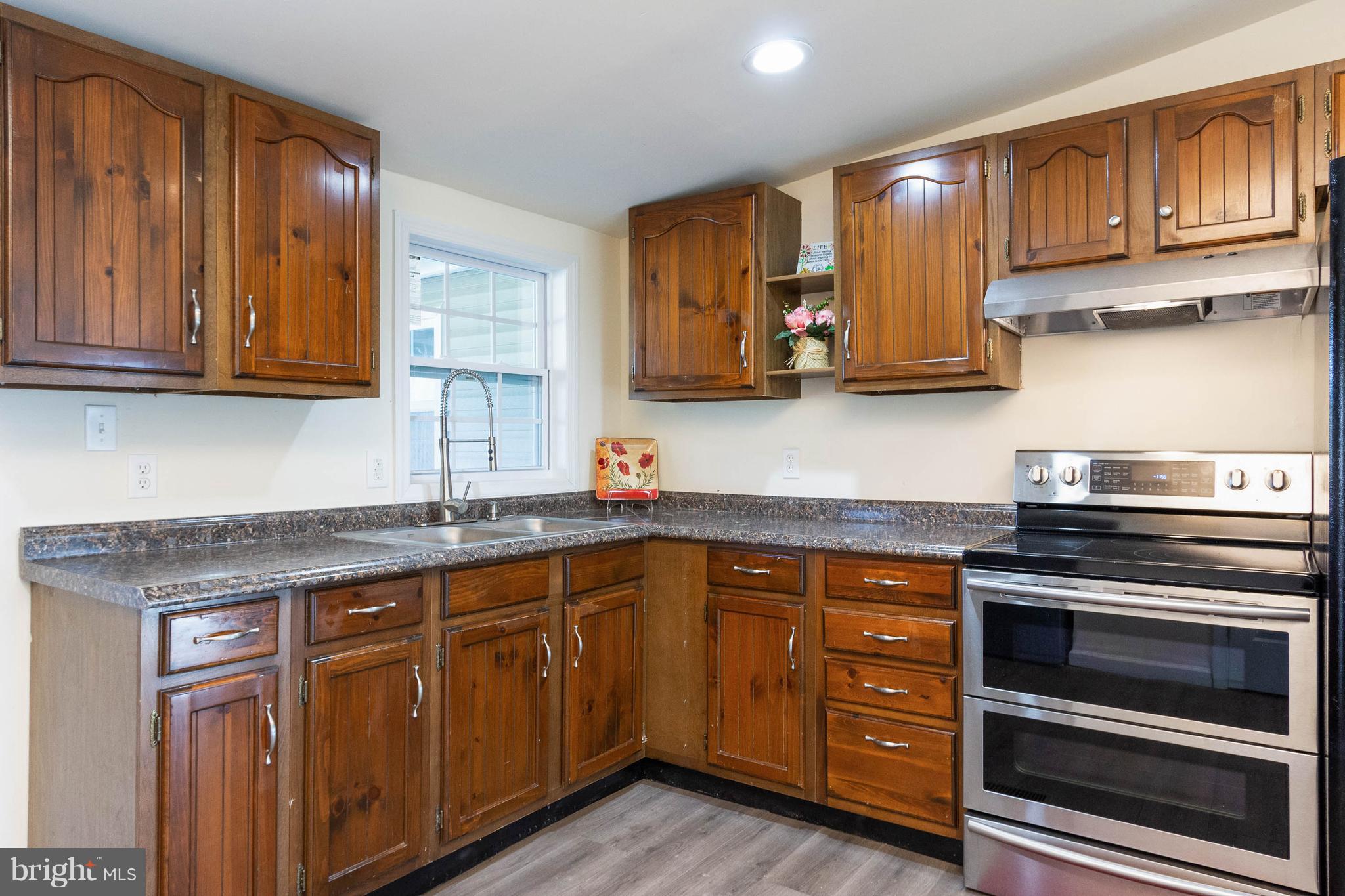 3141 Partlow Road Partlow, VA 22534 - Photo 14 of 25 a kitchen with sink cabinets and stainless steel appliances