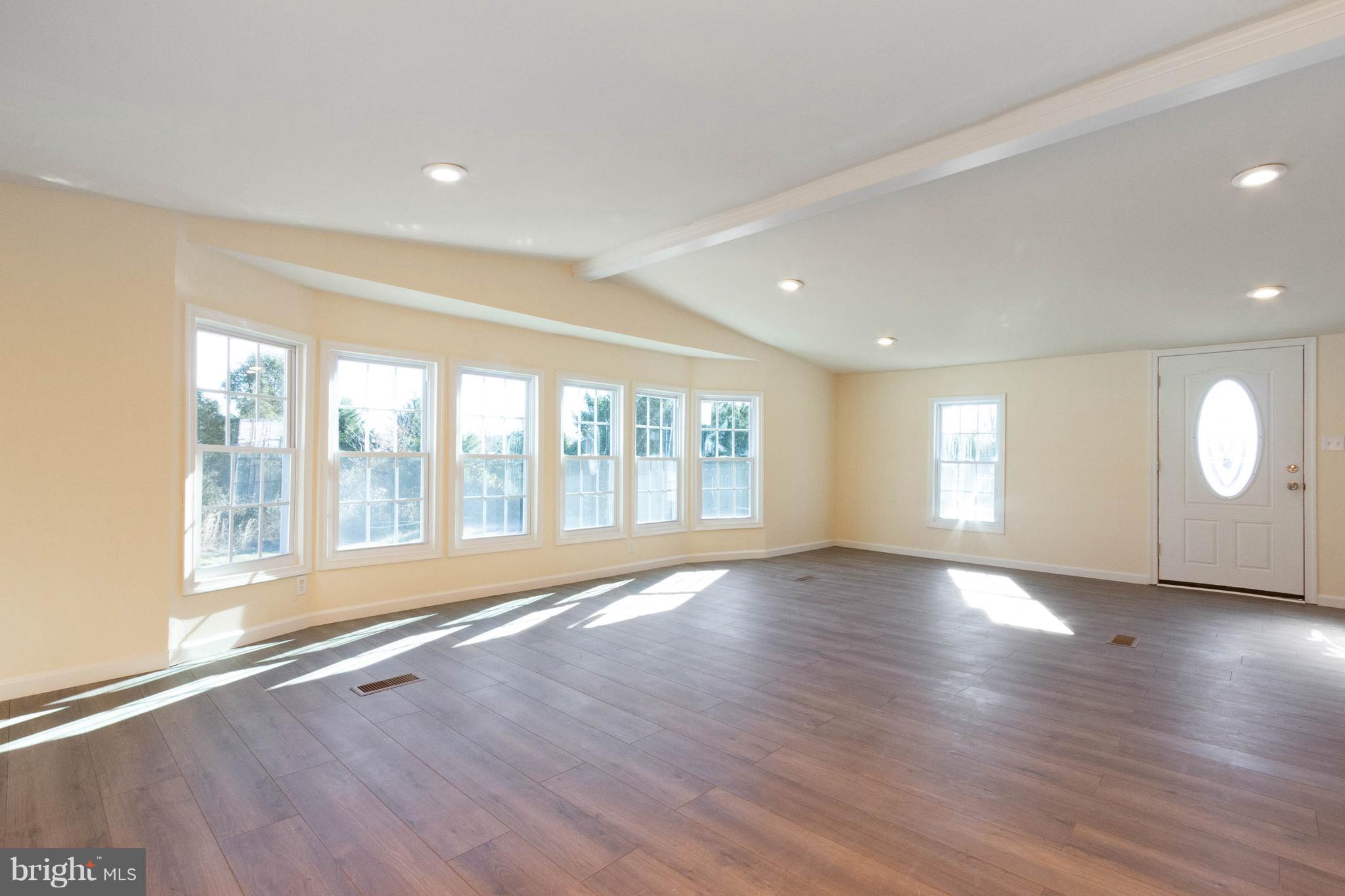 3141 Partlow Road Partlow, VA 22534 - Photo 18 of 25 a view of an empty room with wooden floor and a window
