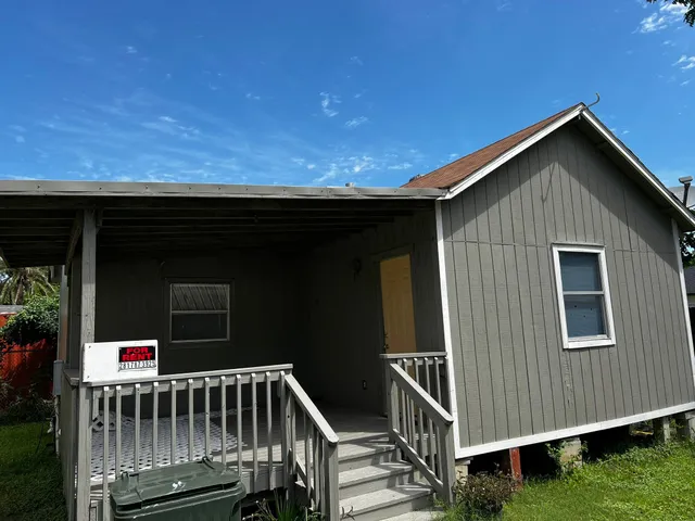 a view of backyard with deck and deck