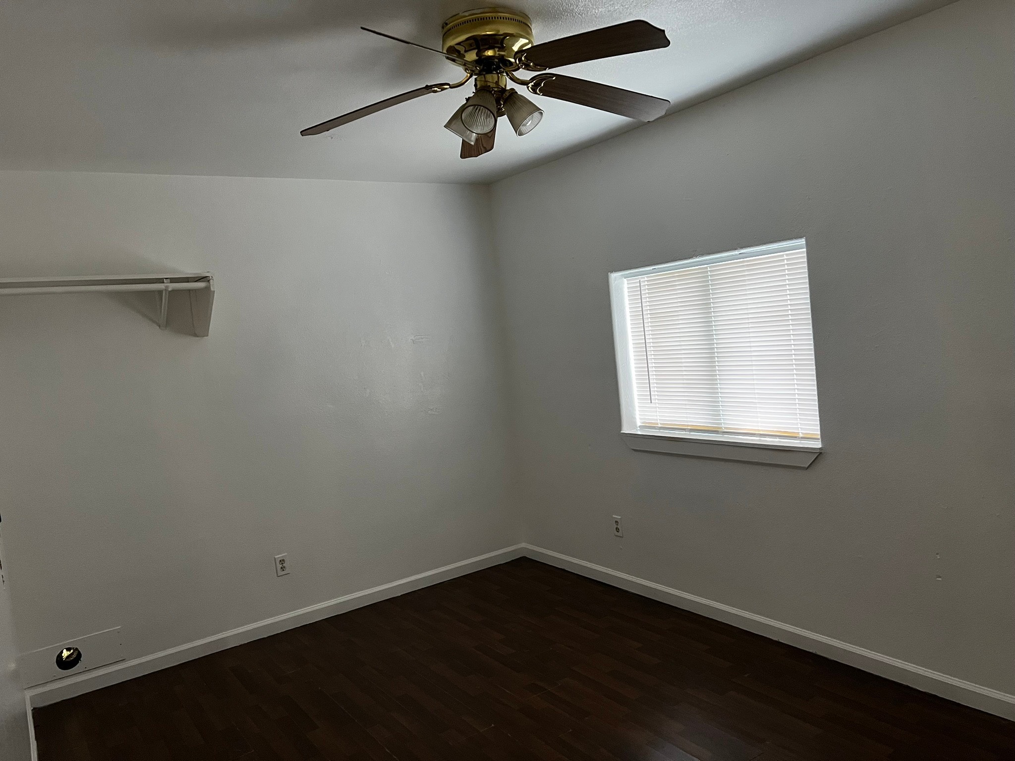 4817 12th Street, Unit A Bacliff, TX 77518 - Photo 3 of 6 an empty room with a window and a fan