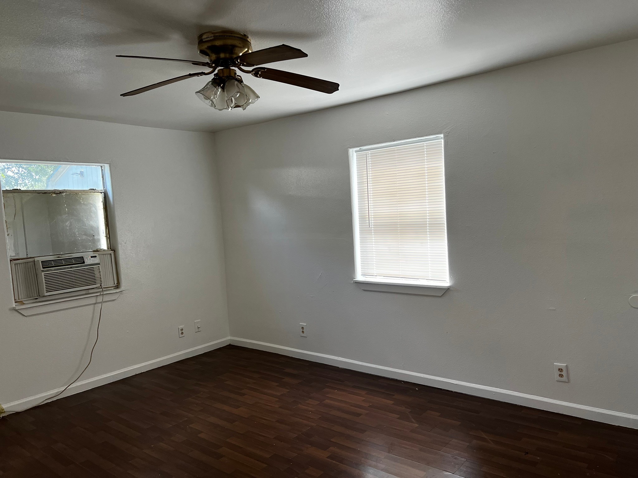 4817 12th Street, Unit A Bacliff, TX 77518 - Photo 6 of 6 an empty room with wooden floor and windows
