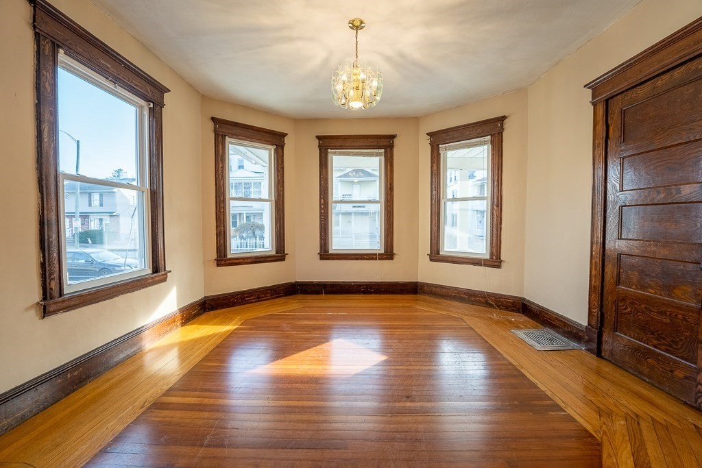 215 White Street Springfield, MA 01108 - Photo 12 of 33 a view of an empty room with window and wooden floor