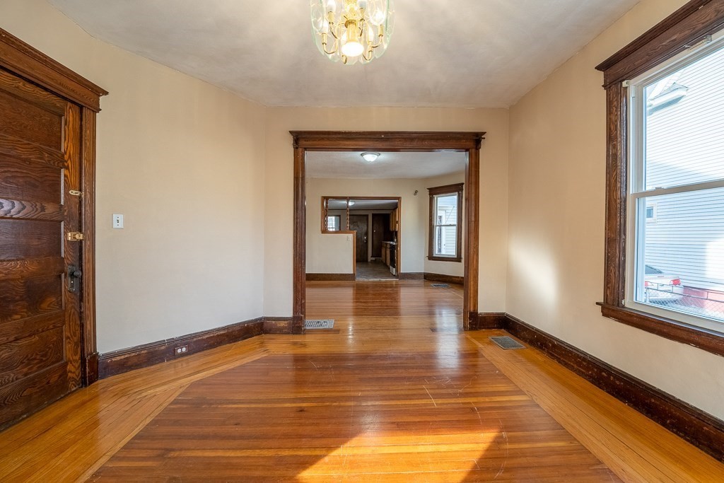 215 White Street Springfield, MA 01108 - Photo 13 of 33 a view of a room with wooden floor and a window