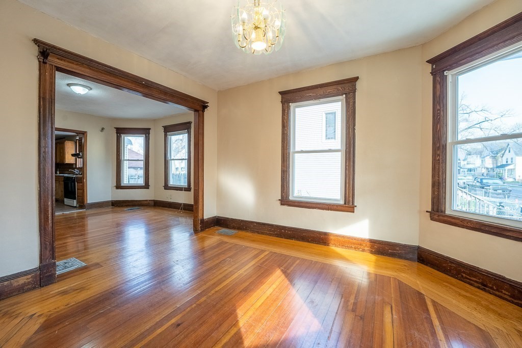 215 White Street Springfield, MA 01108 - Photo 14 of 33 a view of an empty room with wooden floor and a window