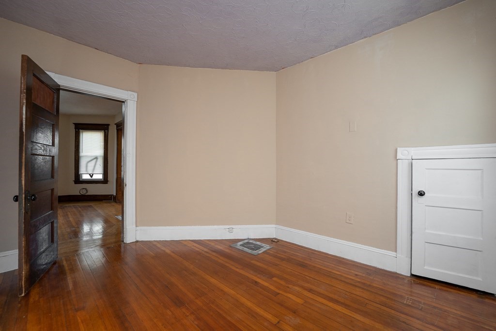 215 White Street Springfield, MA 01108 - Photo 17 of 33 wooden floor in an empty room