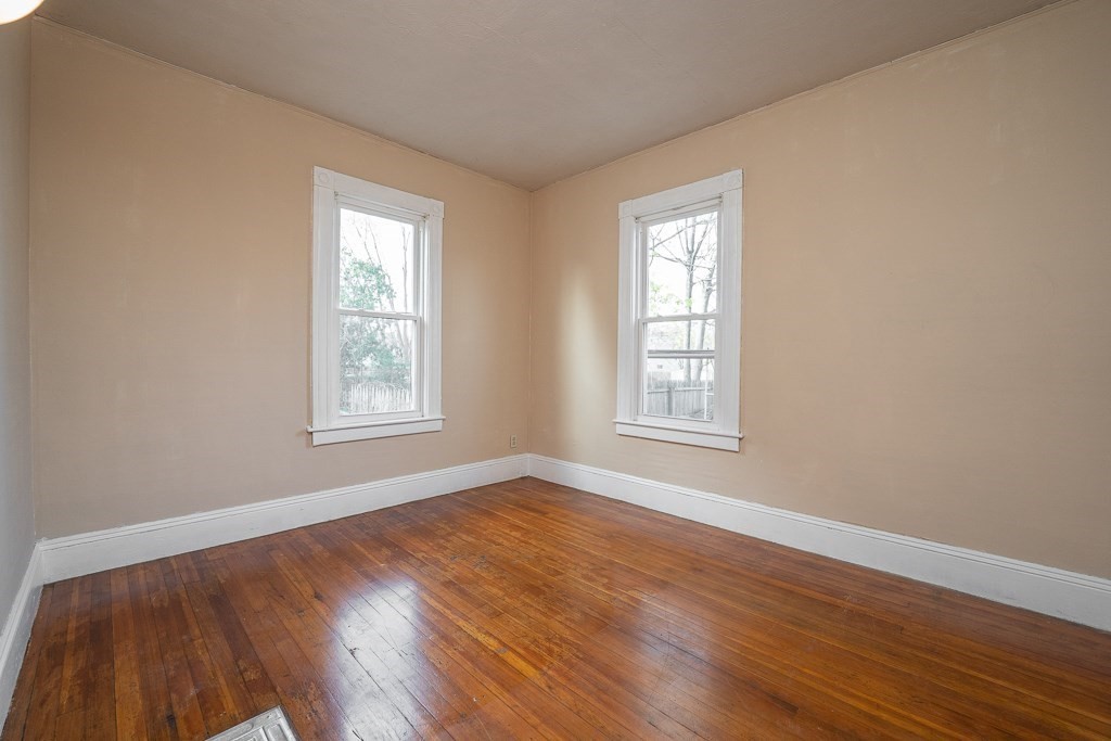 215 White Street Springfield, MA 01108 - Photo 21 of 33 a view of an empty room with wooden floor and a window