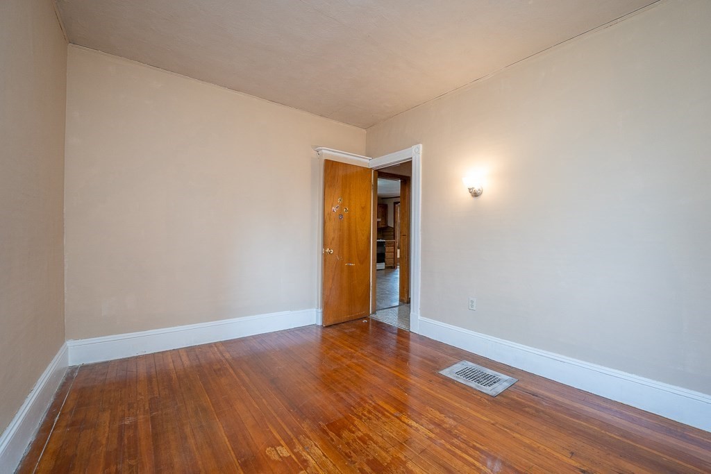 215 White Street Springfield, MA 01108 - Photo 23 of 33 a view of an empty room with wooden floor
