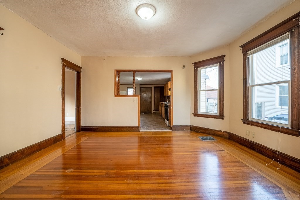 215 White Street Springfield, MA 01108 - Photo 10 of 33 a view of an empty room with window and wooden floor