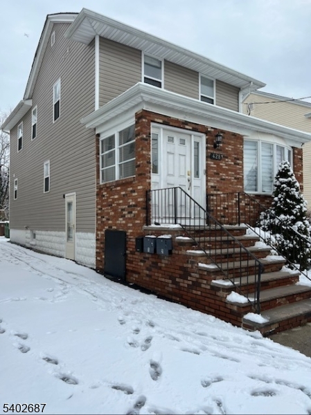 428 Brook Street, Unit 1 Linden, NJ 07036 - Photo 2 of 14 a front view of a house with a yard