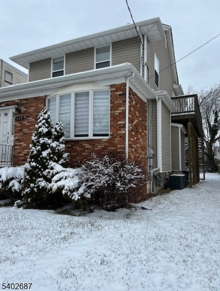 428 Brook Street, Unit 1 Linden, NJ 07036 - Photo 3 of 14 a view of a house with a small yard and a large window