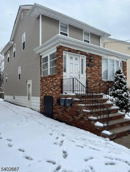 428 Brook Street, Unit 1 Linden, NJ 07036 - Photo 4 of 14 a front view of a house with a yard