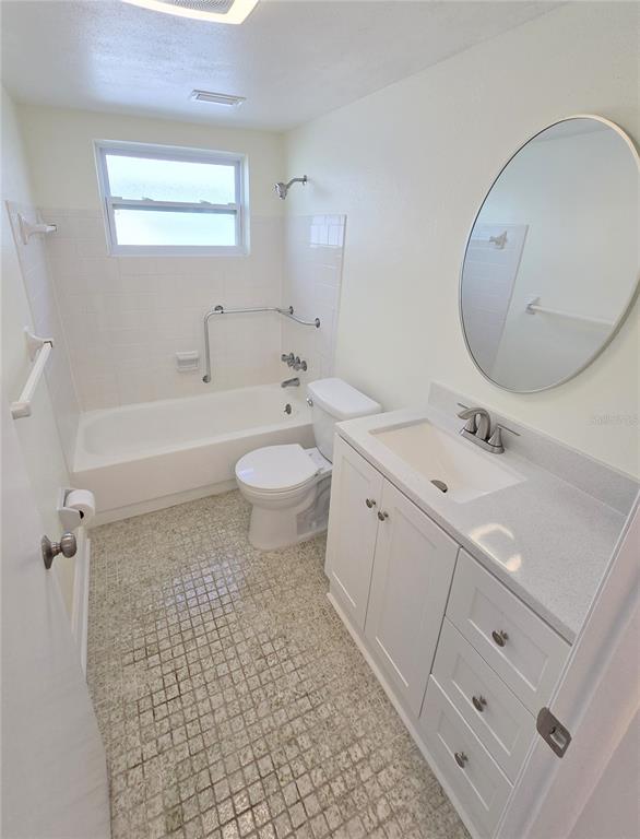 3604 Delta Place Holiday, FL 34691 - Photo 15 of 41 a bathroom with a double vanity sink mirror and toilet