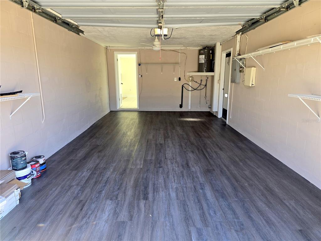 3604 Delta Place Holiday, FL 34691 - Photo 17 of 41 a view of a room with wooden floors and white walls