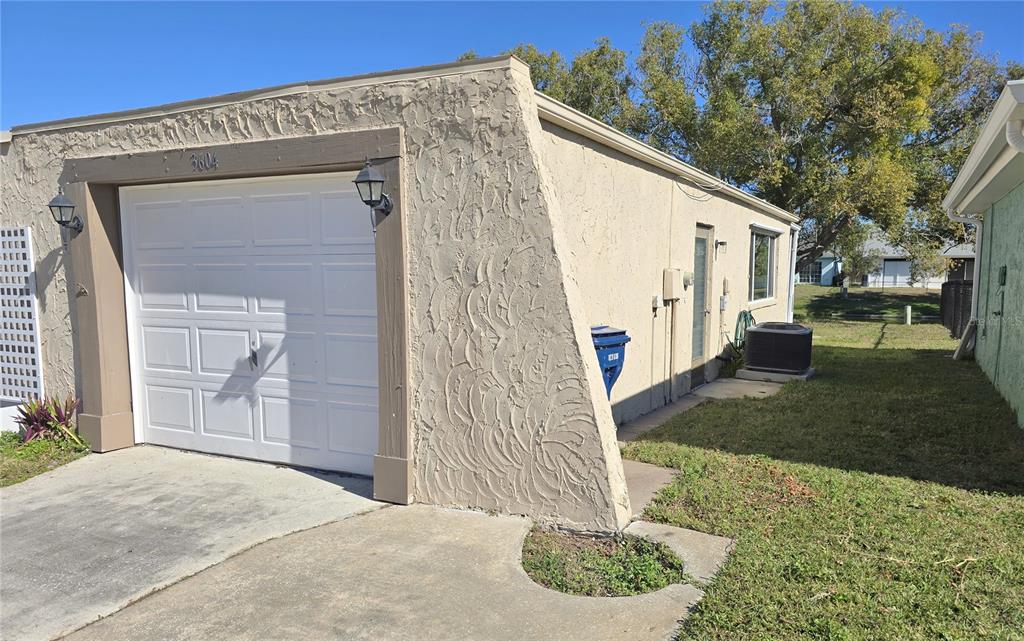 3604 Delta Place Holiday, FL 34691 - Photo 39 of 41 a front view of a house with a yard