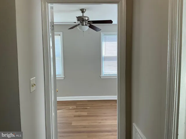a view of a hallway with a glass door