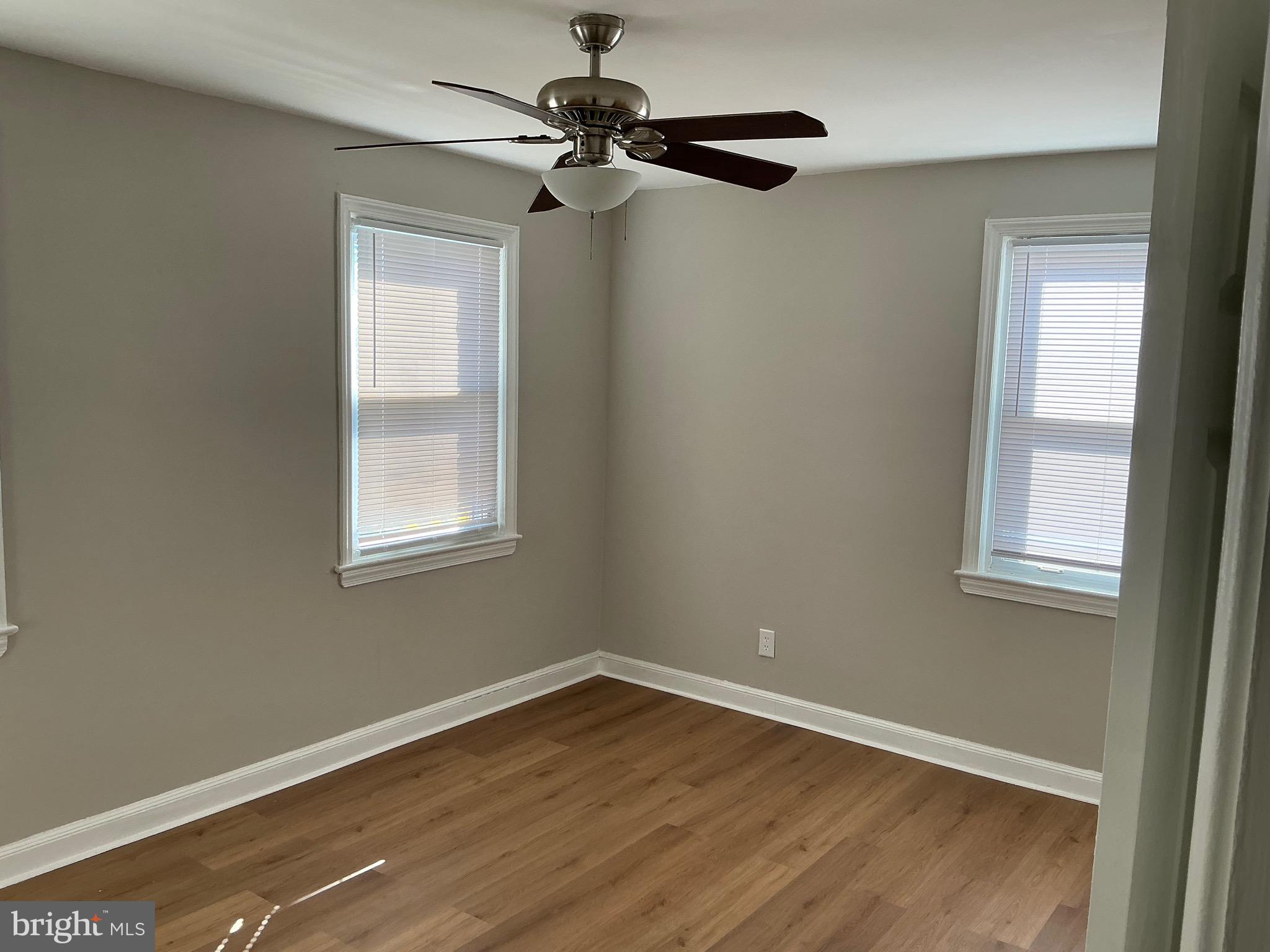 1671 Fort Davis Place Southeast Washington, DC 20020 - Photo 13 of 22 a view of an empty room with wooden floor and a window