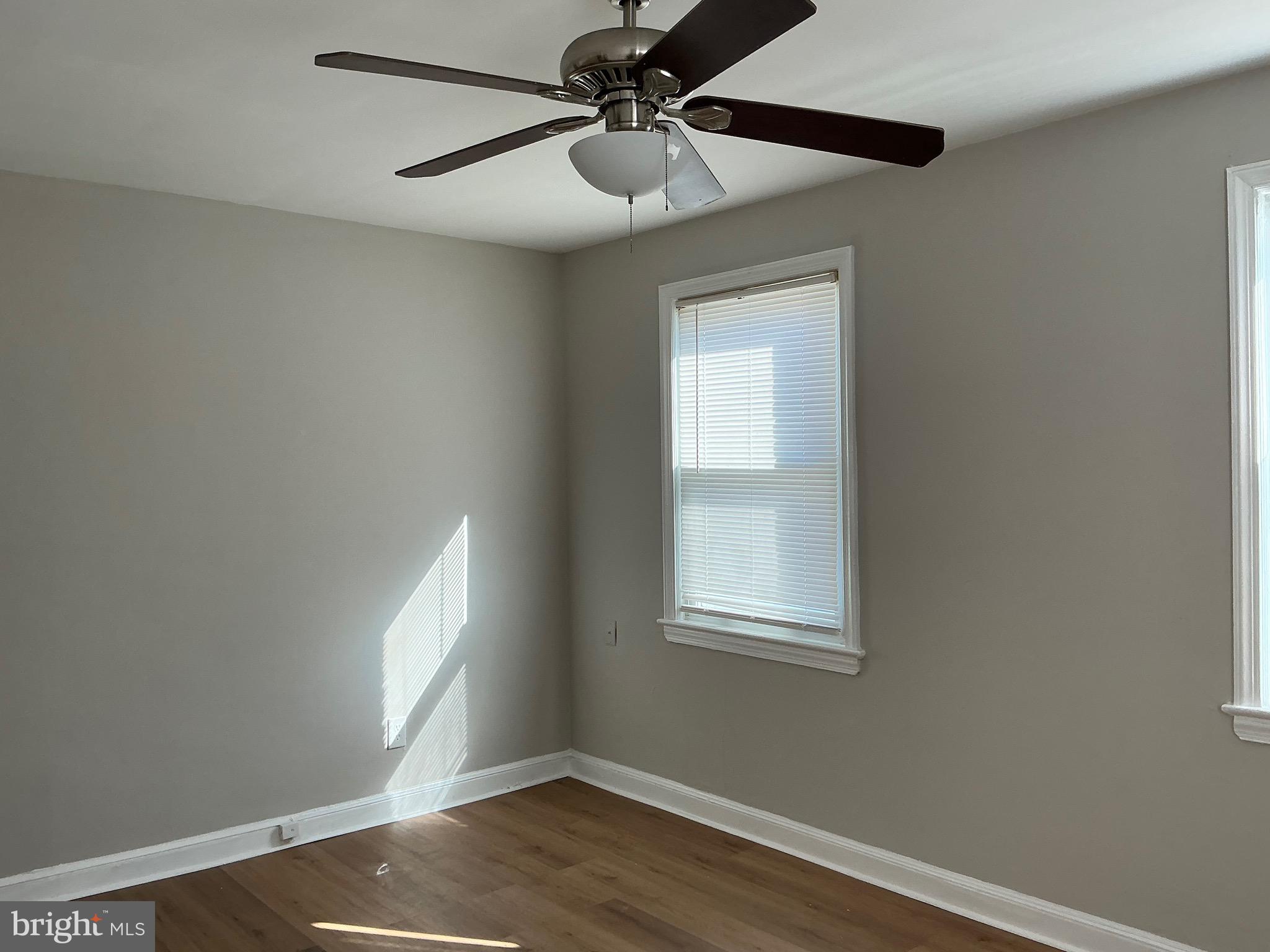 1671 Fort Davis Place Southeast Washington, DC 20020 - Photo 16 of 22 a view of an empty room with wooden floor and a window
