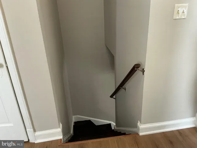 a bathroom with a window and a shower