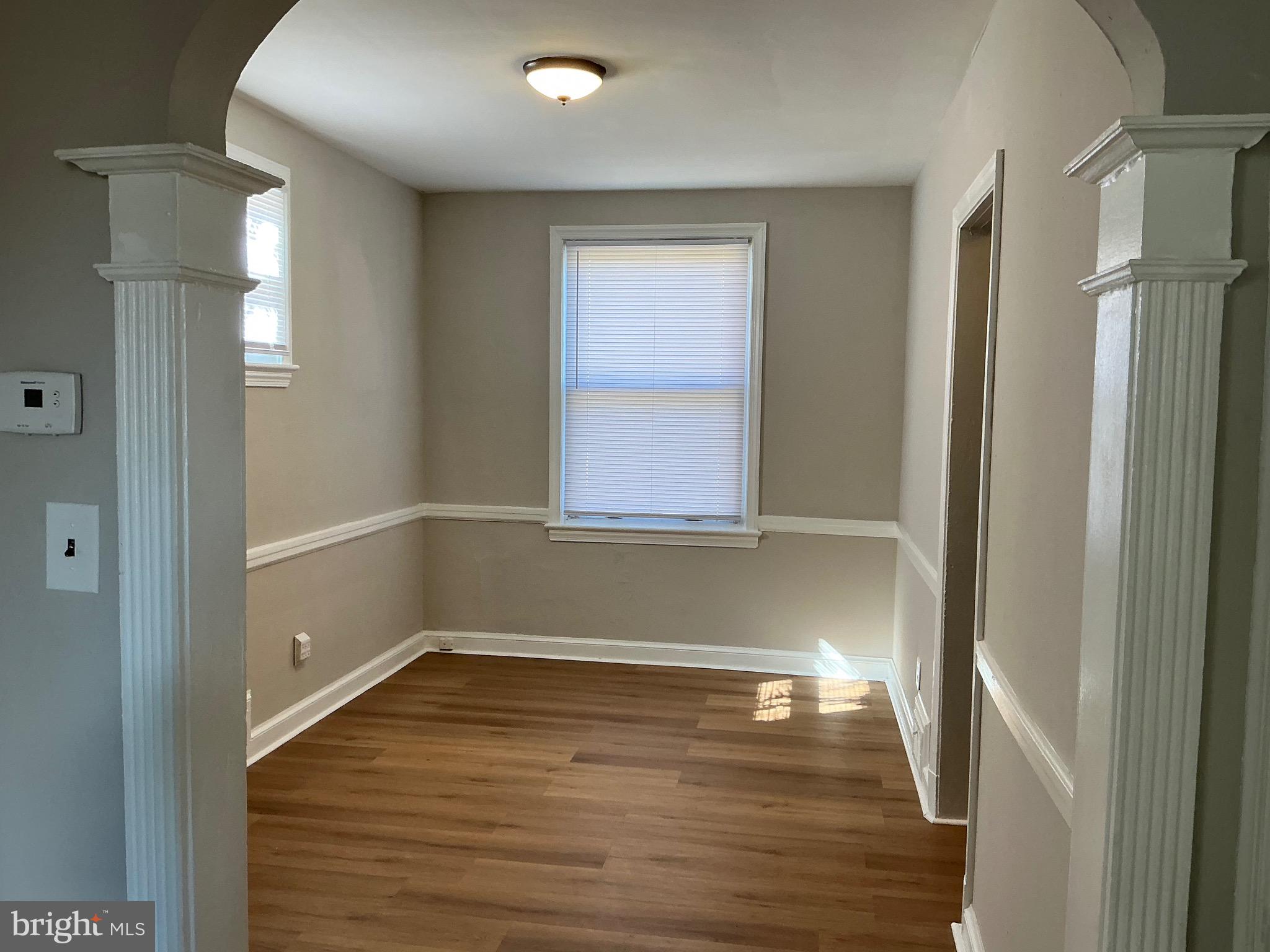 1671 Fort Davis Place Southeast Washington, DC 20020 - Photo 8 of 22 a view of room with window and hardwood floor