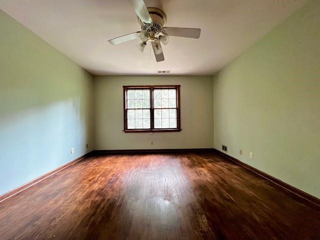 4541 Arcado Road Southwest Lilburn, GA 30047 - Photo 12 of 16 wooden floor in an empty room with a window