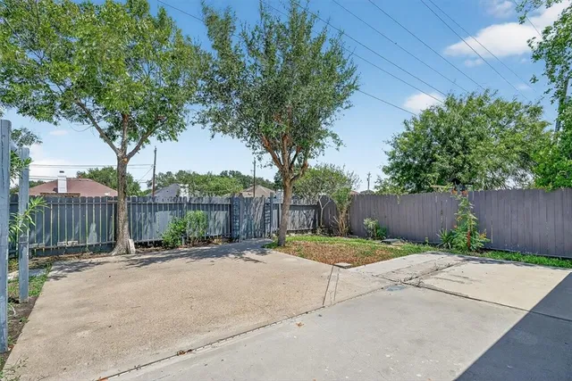 a backyard of a house with lots of green space
