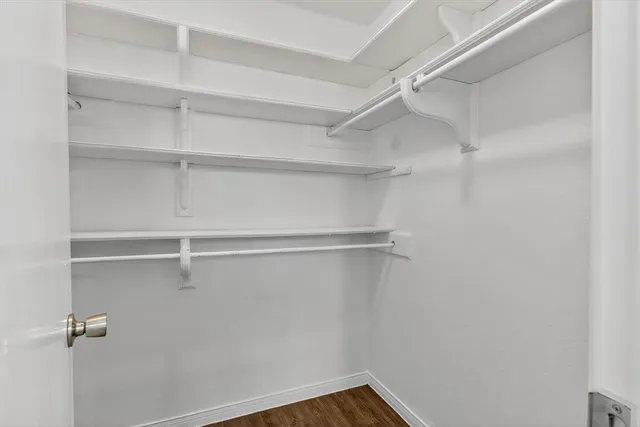 a view of a room with shelf on the wall