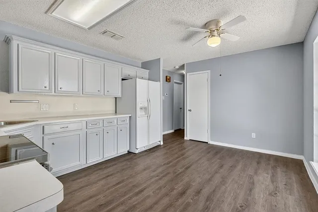 a view of a kitchen with electric appliances