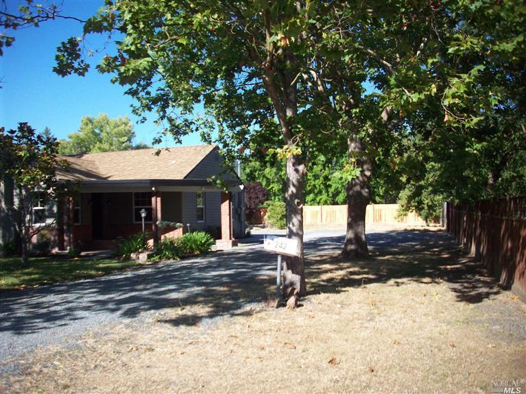 242 Middle Rincon Road Santa Rosa, CA 95409 - Photo 1 of 1 a front view of a house with a yard